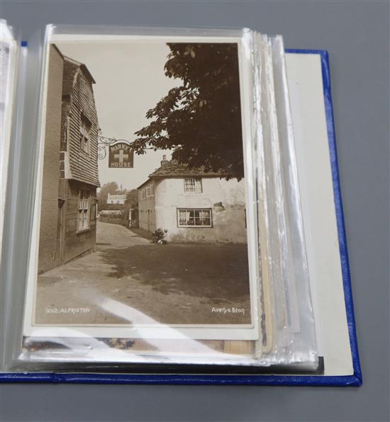 A collection of Edwardian and later postcards of Alfriston views, a stamp album and a collection of silks